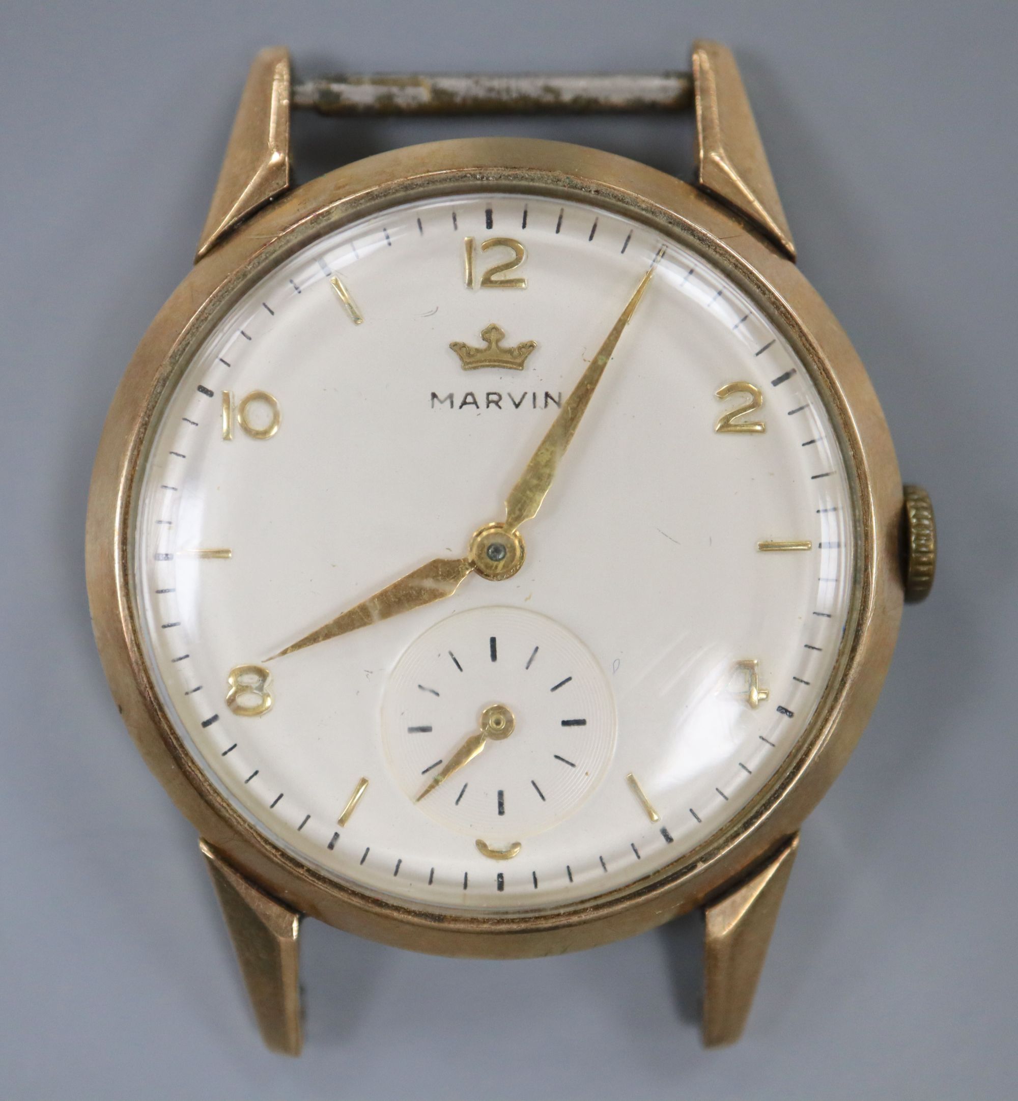 A gentlemans 9ct gold Marvin manual wind wrist watch, no strap, case diameter 30mm ex. crown, gross 22.8 grams.